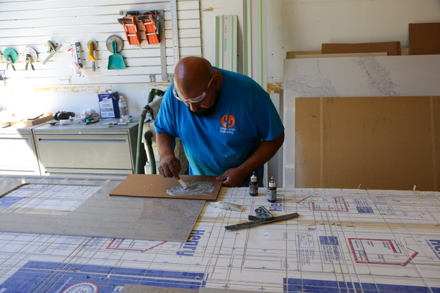 Orange Cactus Remodeling craftsman fabricating tile in the shop, part of the in-house team serving Tempe, AZ