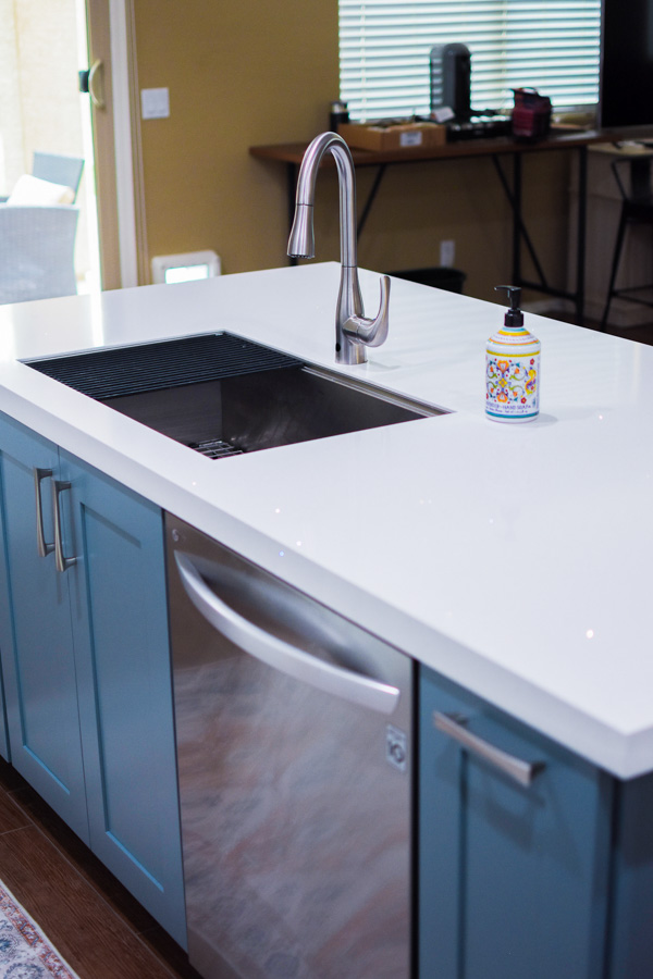 Kitchen remodel with blue cabinetry, a white quartz counter, and a black undermount sink by Orange Cactus Remodeling, serving Dobson Ranch, Mesa, AZ