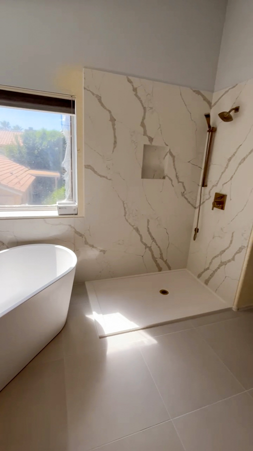 Master bathroom remodel with a marble-look walk-in shower and a freestanding tub by Orange Cactus Remodeling, serving Dobson Ranch, Mesa, AZ