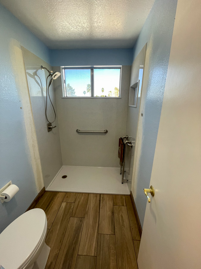 Walk-in tiled shower in a remodeled bathroom by Orange Cactus Remodeling — serving Mesa, AZ